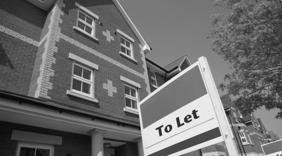 A To Let sign outside a block of flats